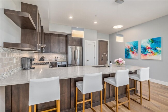 Building Photo - COME HOME TO REFINED DOWNTOWN LUXURY CONDO...