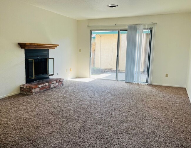 Building Photo - Spacious 2 Bedroom/2 bath duplex with a 2 car garage and laundry hook ups in a great North Modest...