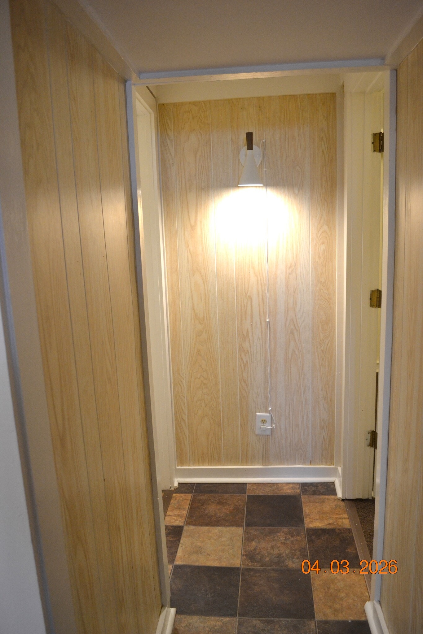 short hallway from living room to bathroom on left and bedroom on right - 222 W Case St