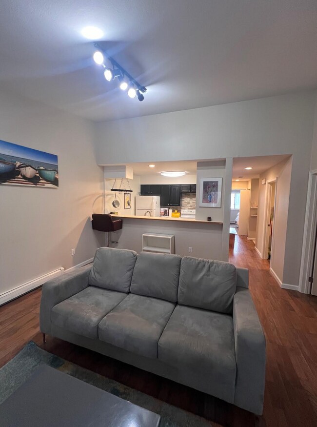 Main living area looking toward kitchen and hallway - 1881 E Tudor Rd