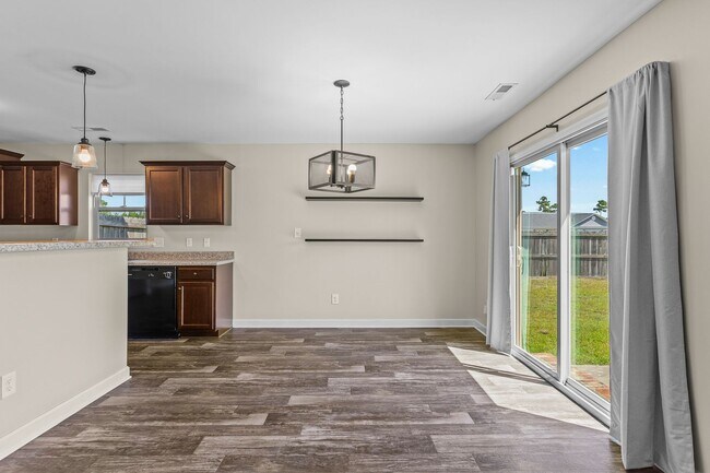 Building Photo - Spacious Home with Natural Light