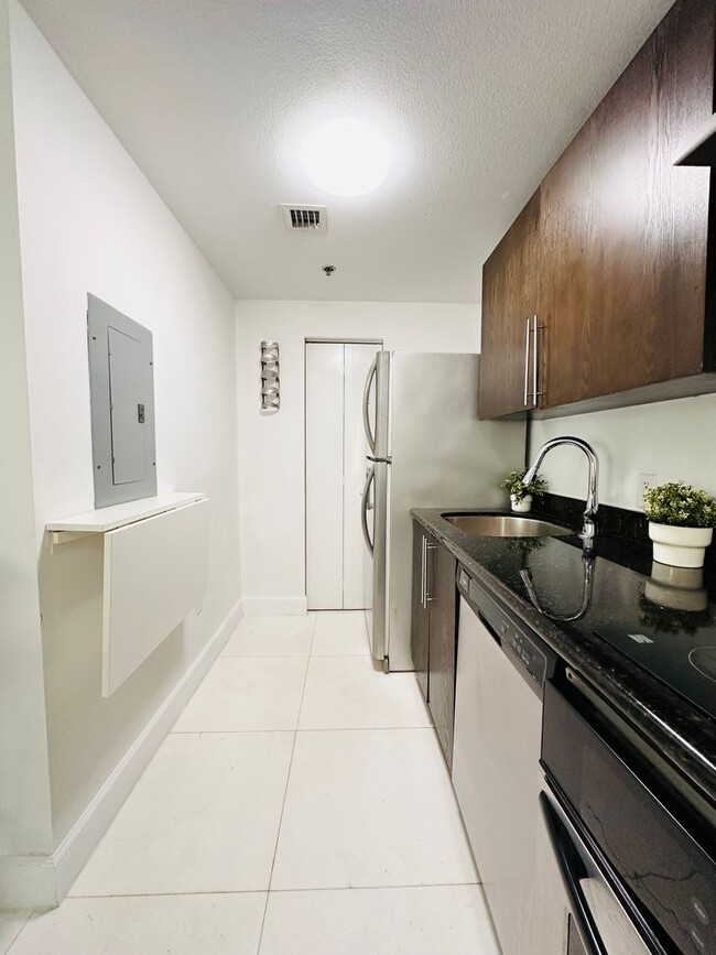 Building Photo - Bright and furnished 1/1 in classy remodel...