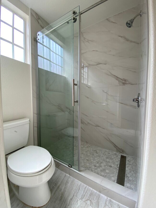Master Bathroom Toilet with brand new shower and flooring - 915 W Arrow Hwy