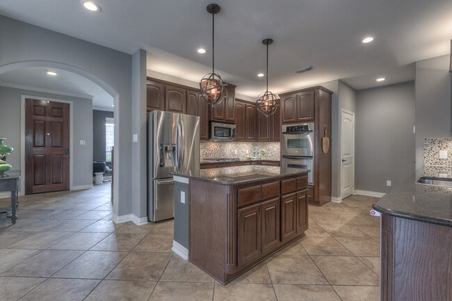 Kitchen with Stainless steel appliances. No fridge provided. - 323 Arbor Ridge Ln