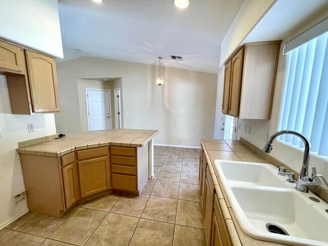 Building Photo - Inviting 3 Bedroom Home with RV Parking an...