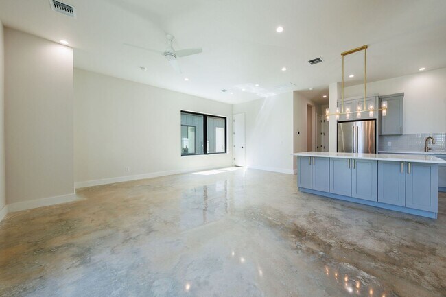 Building Photo - Luxury Redefined: Experience Vibrant Living in this 3-Bedroom Haven in East Austin