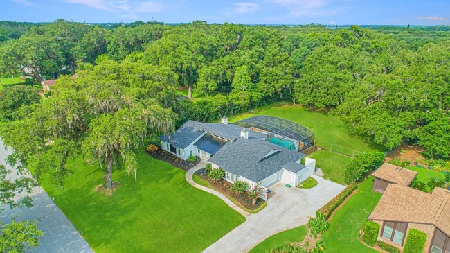 Building Photo - Beautifully Updated 3/2 Pool Home with Large Backyard in Lake Ajay (Gated Community)