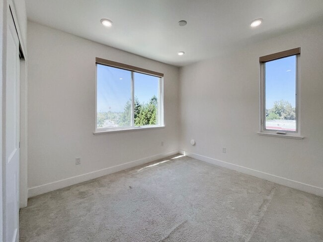 Building Photo - Modern 2BD Fremont Condo – EV Charger, Balcony, & Walk to BART