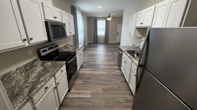 Kitchen from Laundry Area - 9105 Beach Dr SW