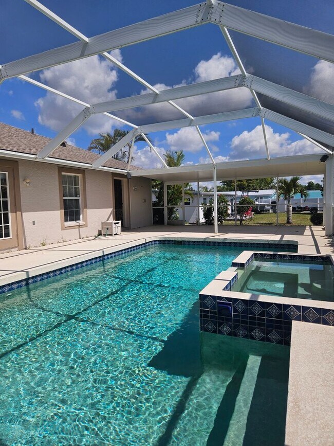 Building Photo - Port Charlotte Waterfront salt water pool annual rental