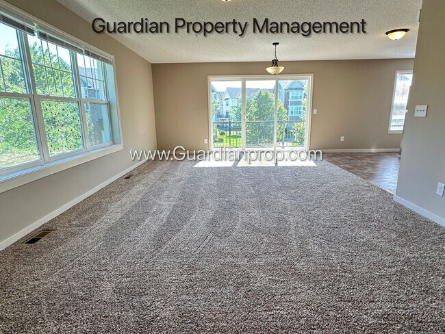 Building Photo - Champlin Corner Unit Town Home, 2 Car Garage, Dishwasher, Washer/Dryer, Balcony