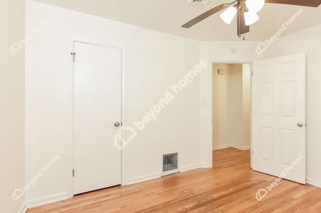 Building Photo - This Cozy 4 bedroom / 2 full bath and 2,09...