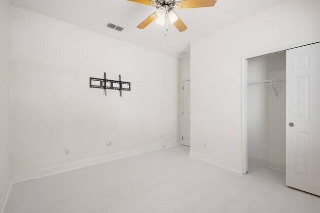 Building Photo - Spacious 6-Bedroom Home Near Lake Nona | 3-Car Garage + Tesla Charger