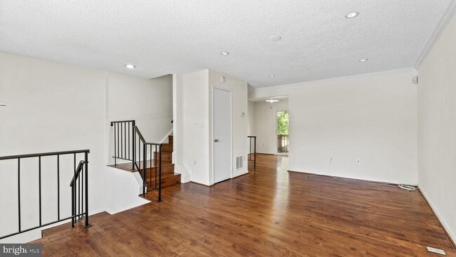 Building Photo - This stunning 3-bedroom, 2-bathroom interior townhome is sure to impress.