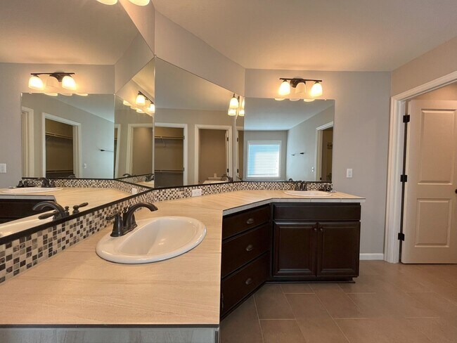 Building Photo - Spacious 4-Bedroom + Bonus Room with Modern Kitchen, Solar Panels & Private Fenced Backyard!