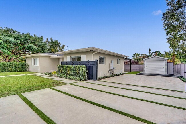 Shed has A/C and flooring. Makes a great office or extra storage. - 11425 NE 3rd Ave