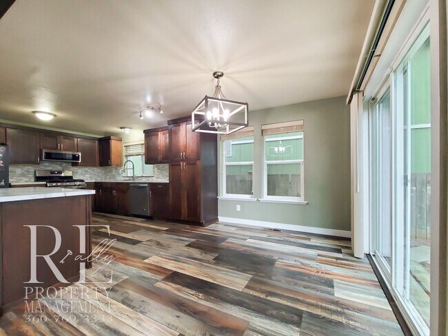 Building Photo - Modernized Two-Story with Open Layout, Gas Fireplace & Large Fenced Yard