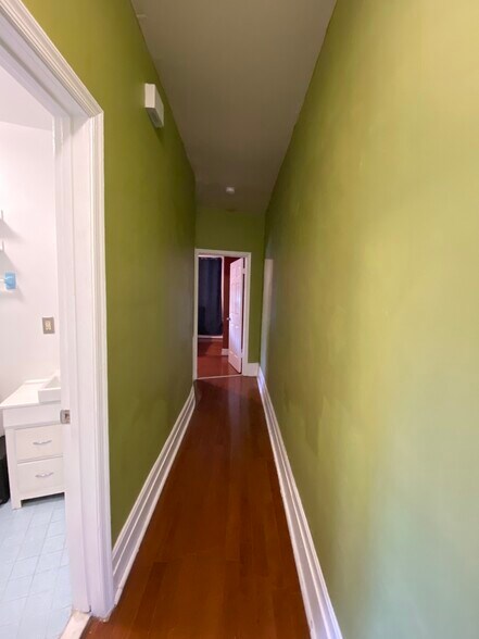 Hallway to bathroom and bedroom with storage closet - 1618 8th St NW