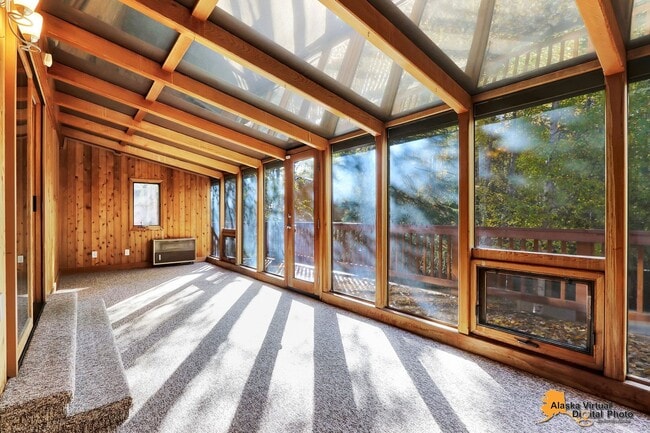 Building Photo - Eagle River Home w/ Fenced Yard, Sunroom, and Garage!