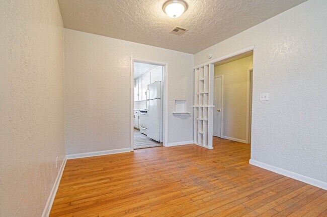 Building Photo - Three Bedroom Home in tree filled neighborhood! Lawn care included!