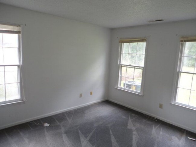 Building Photo - Two bedroom and two bath duplex located ju...