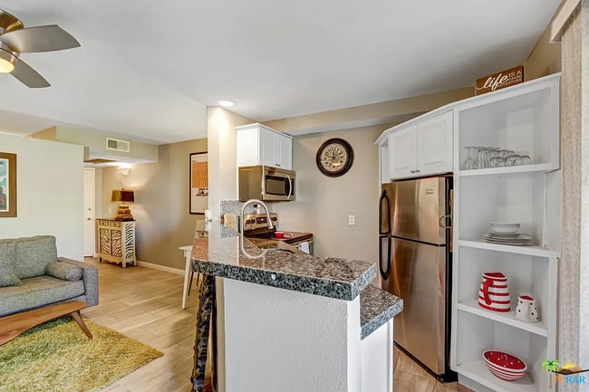 Building Photo - Charming Furnished 1-Bedroom Condo with Mo...