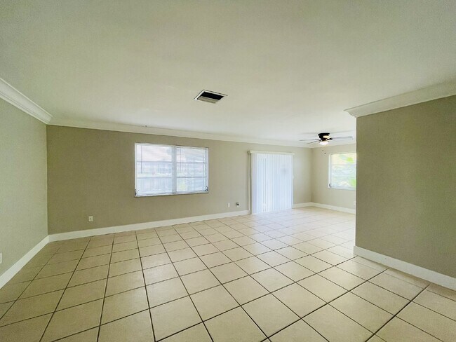 Building Photo - Updated 2-bedroom waterfront duplex with walk-in closets, enclosed Florida room, and canal views ...