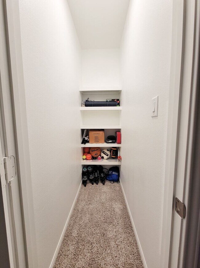 Building Photo - A true gem on a quiet corner lot, this spacious and sun-filled home is tucked away from street no...