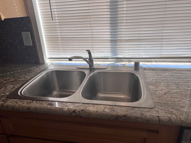 New stainless steel sink and beautiful countertops overlook private backyard - 2356 Canyon Park Dr