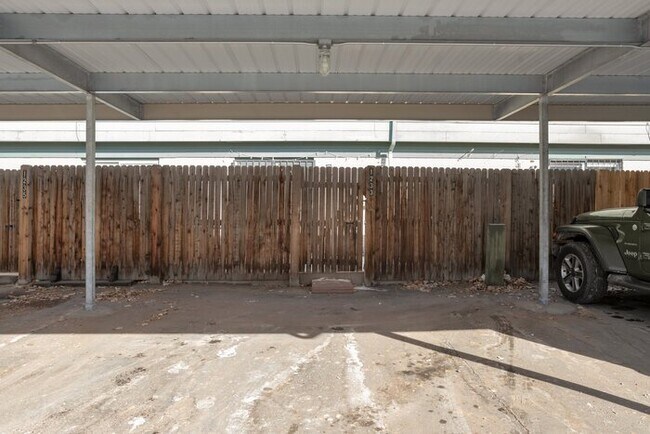 Building Photo - Inviting Townhome w/ 2-car Carport off the...