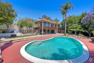 Building Photo - Open Living with a Private Pool Oasis