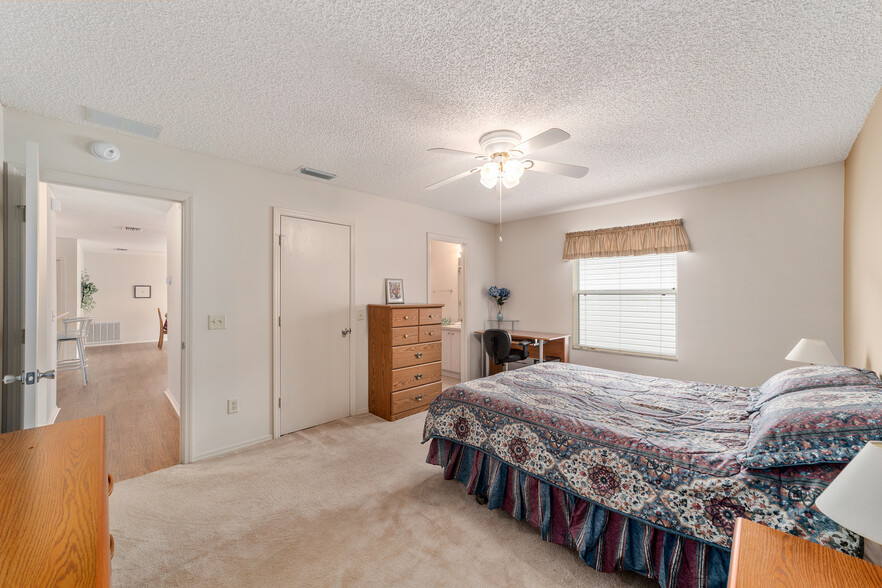 Queen size bed, media area, bathroom adjoins - 8201 SE 169th Palownia Loop