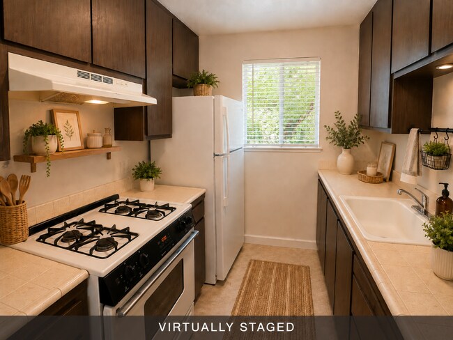 Building Photo - Updated 2 bedroom 1 bath condo in a quiet park like setting with a community pool