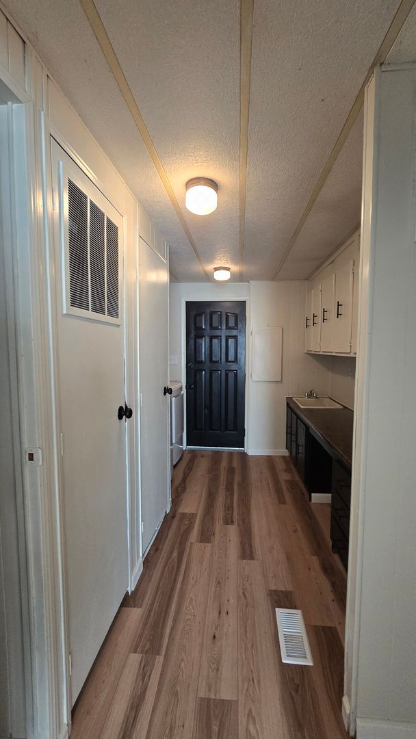 Building Photo - Welcome to this 3-bedroom, 2-bathroom home...
