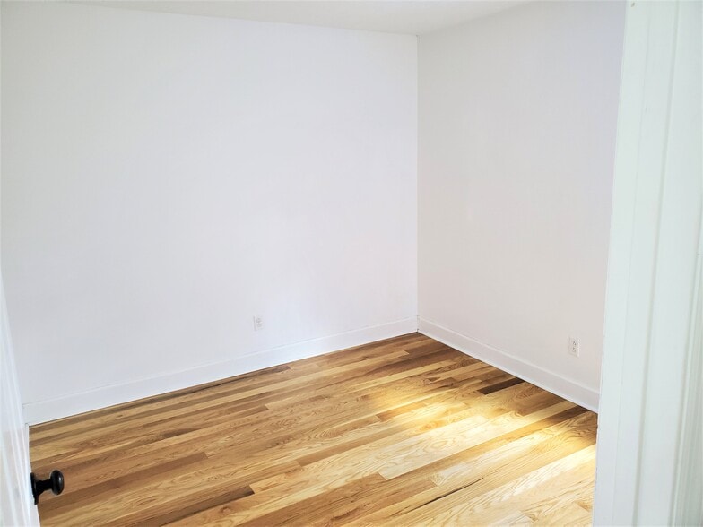 Second Bedroom - contains a closet and window overlooking the backyard. - 1025 Wade Ave