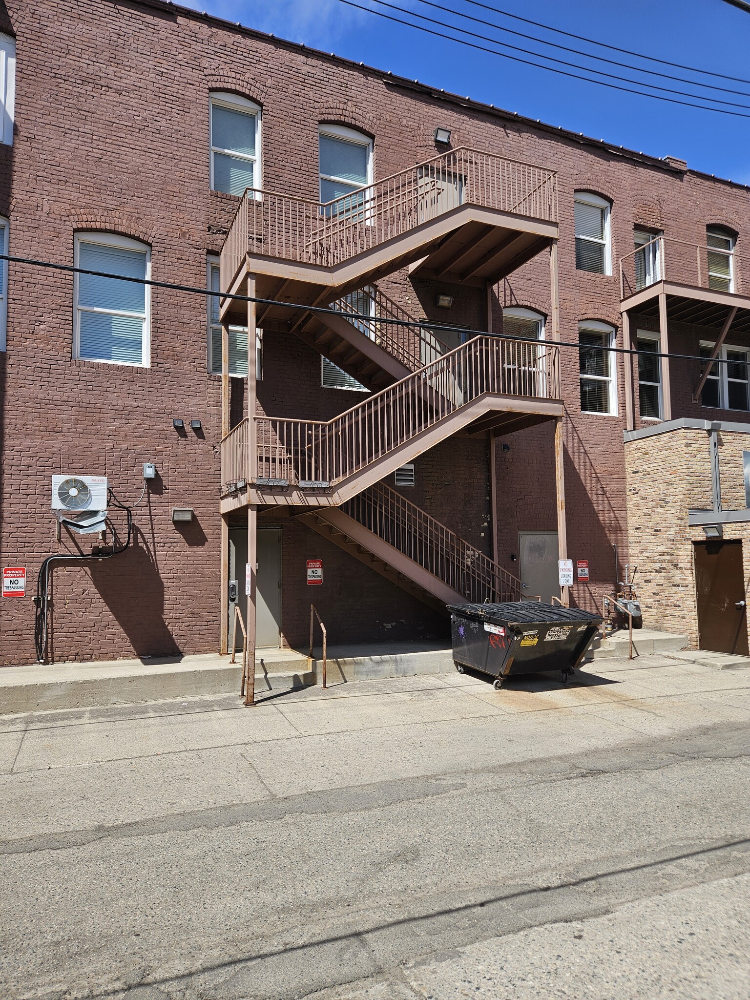 Alley Access to unit floor via stairs, main floor access - 319 Broadway N