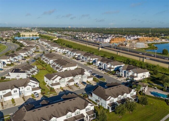 Building Photo - Immaculate Townhome · Dual En-Suite Bedrooms + Flex Loft · Cable & Internet Included · 3.5 Miles ...