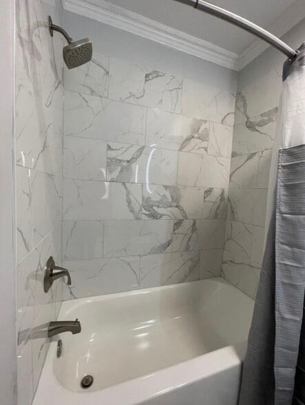 Custom tile shower with marble-style surround. - 289 Preswicke Ml