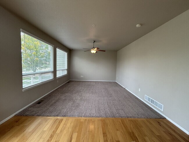Building Photo - $500 Off First Month Of Rent! Modern 3BR Townhome with Fenced Yard & Garage