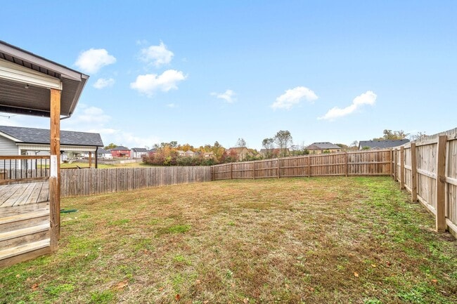 Building Photo - Pet Friendly Three Bedroom with Bonus!