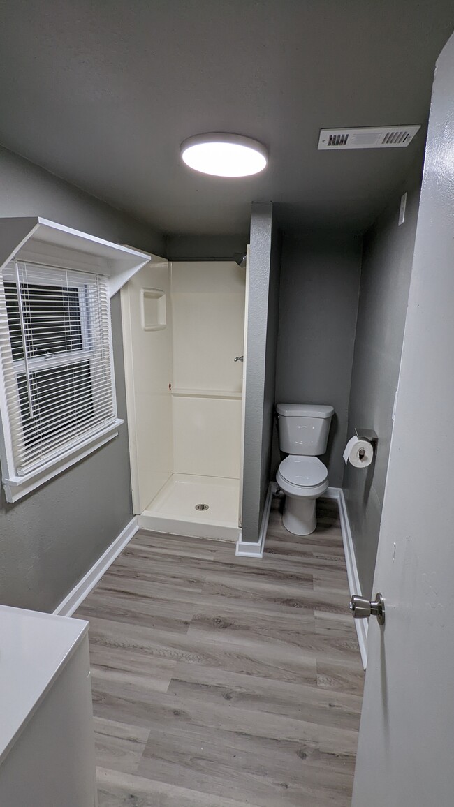 bathroom facing toilet and shower - 600 W Main St