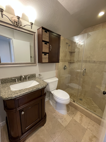 View of the Upstairs Bathroom with walk in shower - 6633 Queensclub Dr