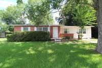 Building Photo - North Pensacola 2BR, 1BA Brick Duplex with Fresh Paint, Wood-Looking Flooring, Fenced Backyard.