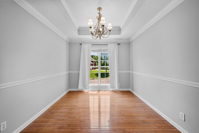 Building Photo - Stunning Stone Fireplace • Finished Basement • Fenced Yard