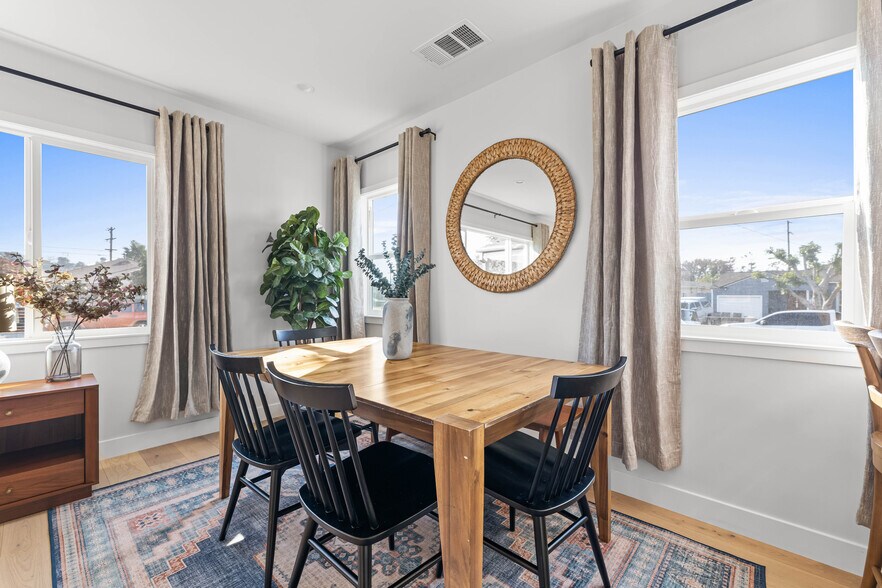 Dining area with West Elm furniture and decor. Table sits six and can expand to sit up to 8. - 1823 N Ditman Ave