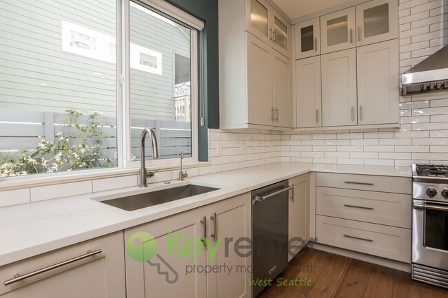 Building Photo - Spacious Living with Balconies, Deck, and Private Yard