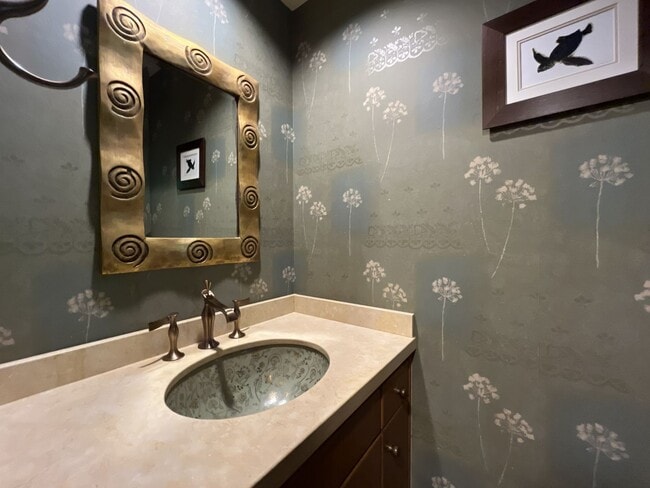 Building Photo - One-of-a-Kind Custom Home with Wall of Windows, Stone Fireplaces, Expansive Entertainment Space &...