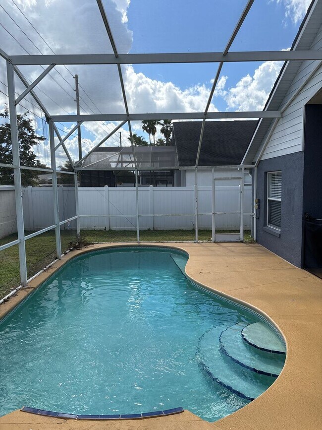 Building Photo - Spacious 4-Bedroom Pool Home in Indian Creek – Kissimmee, FL