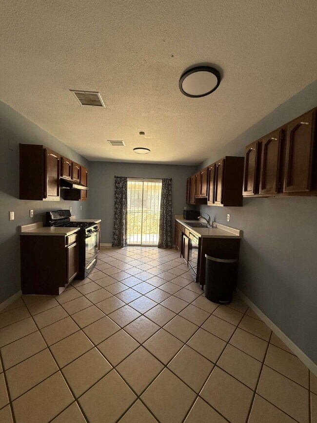Building Photo - Well, kept three-bedroom, two baths home with Solar Panels. A must see, lease today! 11797 Imperi...