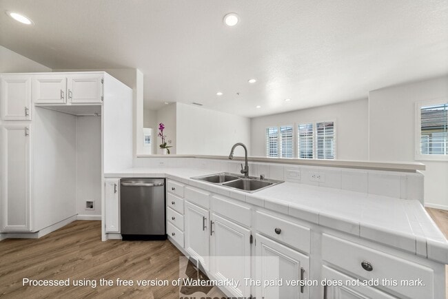 Building Photo - Welcome to this stunning 2-bedroom condo in gated community